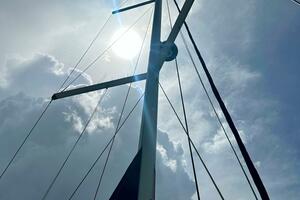Mast of 2015 Beneteau Oceanis 45 sailboat against cloudy sky