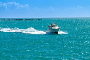 2007 Grady-White Express 360 boat cruising on turquoise ocea
