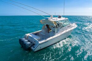 2007 Grady-White Express 360 boat cruising on open blue sea.