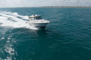 2007 Grady-White Express 360 cruising on open ocean under cl