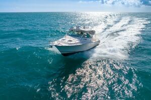 2007 Grady-White Express 360 cruising on open ocean under cl