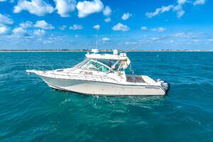 2007 Grady-White Express 360 boat on open sea under blue sky