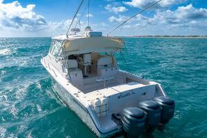 2007 Grady-White Express 360 boat on open sea under a clear 