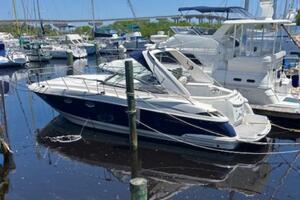 2007 Monterey 350 Sport Yacht docked at a marina, surrounded