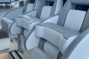 Luxury seating on a 2018 Regulator 41 boat, featuring sleek design and comfort.