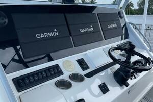 2018 Regulator 41 boat helm with Garmin navigation displays and controls.