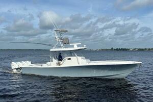 2018 Regulator 41 boat cruising on open water under cloudy skies.