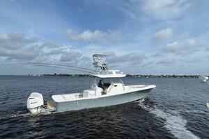 2018 Regulator 41 boat cruising on open water under a cloudy sky.