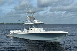 2018 Regulator 41 boat cruising on open water under cloudy skies.