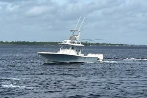 2018 Regulator 41 boat cruising on open water under cloudy skies.