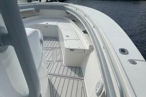 2018 Regulator 41 boat deck with seating, docked near waterfront homes.