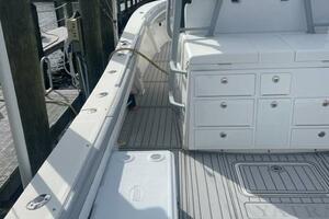 2018 Regulator 41 boat with spacious deck and storage, docked at marina.