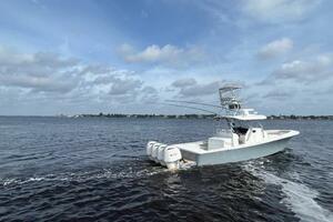 2018 Regulator 41 boat cruising on open water under a partly cloudy sky.