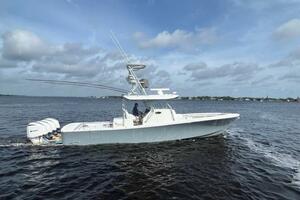 2018 Regulator 41 boat cruising on open water under cloudy skies.
