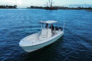 2023 Contender 24 Sport boat on calm blue waters, scenic coa