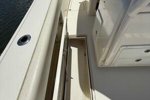 2015 Cobia 296 Center Console boat deck with storage compart