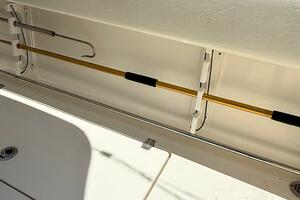2015 Cobia 296 Center Console boat interior with fishing rod