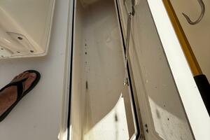 Open storage compartment on 2015 Cobia 296 Center Console bo