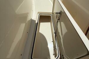 2015 Cobia 296 Center Console storage compartment, open lid,