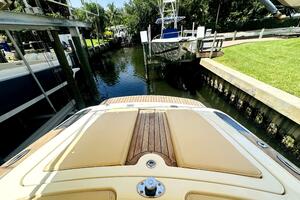 2013 Chris-Craft Corsair 22 docked in a serene canal setting