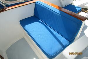 48' DeFever flybridge starboard forward seating