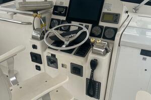 Control panel of a 2001 Pursuit 3000 Offshore boat with stee