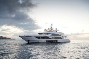 Luxury Majesty 140 yacht cruising at sunset, 2020 model.