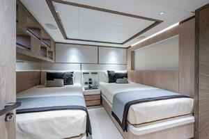 Luxurious twin bedroom in 2020 Majesty 140 yacht, featuring 