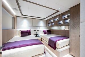 Luxurious twin bedroom on 2020 Majesty 140 yacht with modern