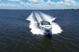 Luxury yacht Real 40 HT 2025 cruising on open water under blue skies.