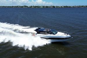 2025 Real 40 HT Luxury yacht cruising on open water, creating a dynamic wake.