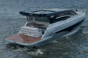 2025 Real 40 HT Luxury yacht cruising on a serene lake.