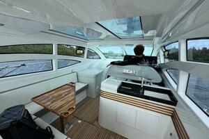 Luxurious interior of 2025 Real 40 HT yacht with modern design and panoramic windows.