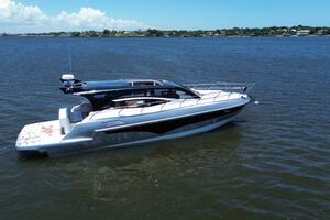 Luxury yacht Real 40 HT 2025 model cruising on a serene blue lake.