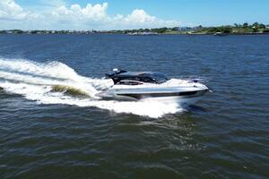 Luxury yacht Real 40 HT 2025 cruising on open water under clear skies.