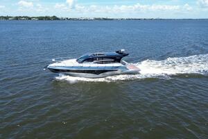 2025 Real 40 HT Luxury yacht cruising on open water under a clear sky.