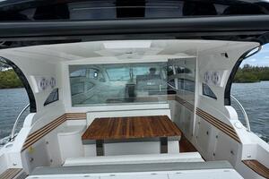 2025 Real 40 HT Luxury yacht with sleek design and spacious seating area.