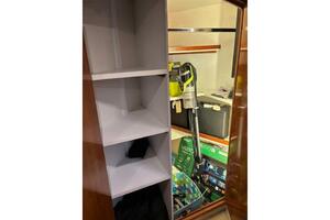 Storage area inside 2004 Carver 466 Motor Yacht with shelves