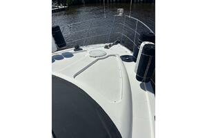 2004 Carver 466 Motor Yacht deck with railing and fenders on