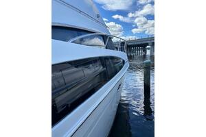 2004 Carver 466 Motor Yacht docked near a bridge under a blu