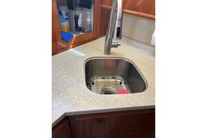 Sink area in 2004 Carver 466 Motor Yacht with modern faucet 