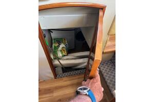 Storage compartment in 2004 Carver 466 Motor Yacht with clea