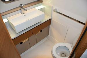 Nicely Finished Bathroom With Door And Freshwater Toilet